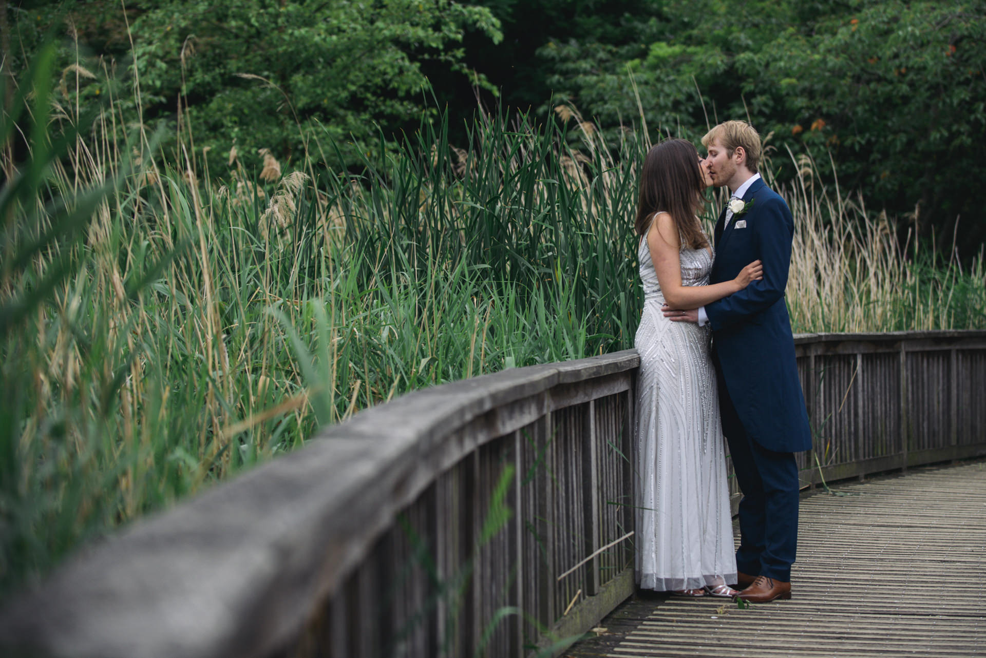 bride and groom kiss in regents park london
