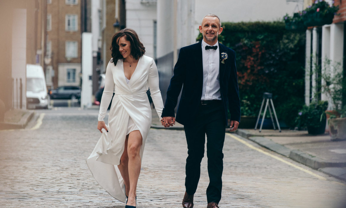 just married couple walks down the road